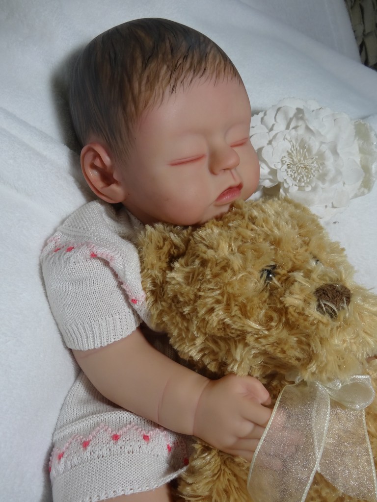 Bernice Baby Reborn Doll has Dark Brown Hand Painted Hair. She soft Peaches and Cream complexion and is soo soft and cuddly.